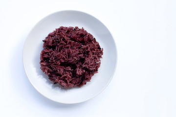 Black sticky rice on white ceramic dish isolated on white background.