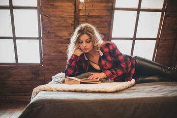 Working and study from home. Woman with a book, at cozy home