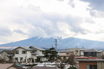 Fujiyama mountain with cloudy shot from train in winter
