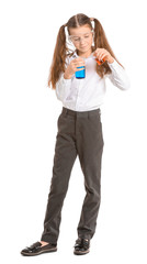 Cute little girl with laboratory glassware on white background