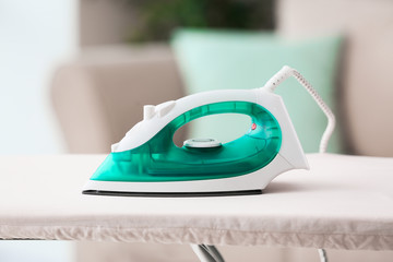 Electric iron on board at home