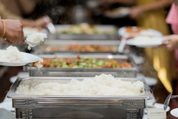 scooping the food, catering, dinner time