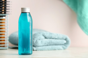 Bottle of shampoo on table