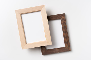 top view of two brown wood photo frame on white