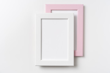 top view of two pink and white wood photo frame