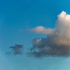 Obraz na płótnie Canvas Fantastic clouds against blue sky