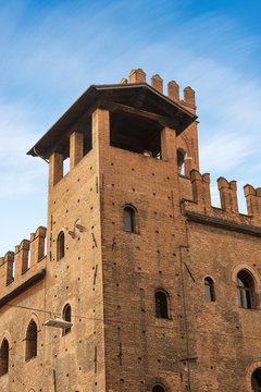 Closeup of the medieval Palazzo Re Enzo (King Enzo palace, 1245) in Via Rizzoli, and the Arengo Tower (1259) in Piazza Maggiore. Bologna downtown, Emilia-Romagna, Italy, Europe
