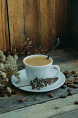 a Cup of coffee on the wooden windowsill