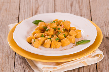 Pumpkin gnocchi with grated amaretti cookies.