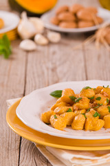 Pumpkin gnocchi with grated amaretti cookies.