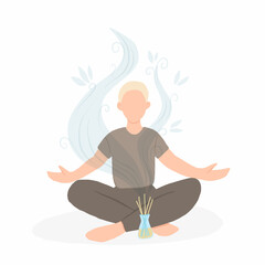 Fototapeta na wymiar Young man sitting in lotus pose with aroma diffuser. Aromatherapy and relax. Self care at home.