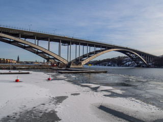 västerbron bridge and boat moorings in stockholm in winter