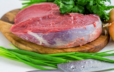 Fresh Raw Beef Steak. Green and onion parsley