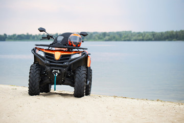 Yellow ATV on the beach. Extreme summer vacation.