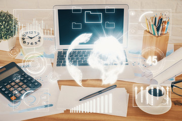 Financial chart drawing and table with computer on background. Double exposure. Concept of international markets.