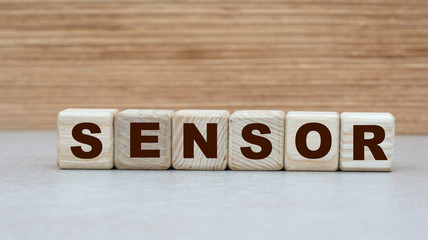 Fototapeta premium concept of the word SENSOR on cubes on a wooden background