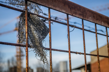 Knitted rusty metal wire fence 