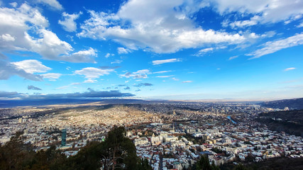 Beautiful aerial view of the central part of city  and blue sky in Tbilisi, Georgia © Victoria Key