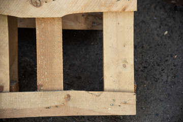 Part of a yellow wooden pallet