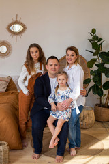 friendly family of four photographed for a portrait