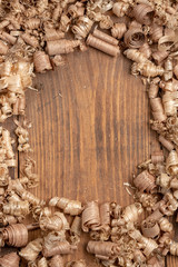 Wood shavings of different sizes from woodworking.