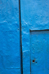 Cusco Peru. Antique colorful door. Worn out