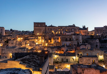 Naklejka premium Night landscape of the Sassi of Matera a historic district iin the city of Matera well-known for their ancient cave dwellings. Basilicata. Italy