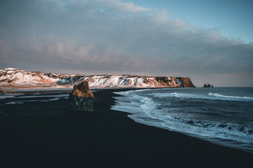 black sand beach at sunset