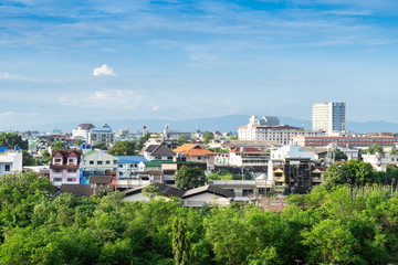 landscape view of cityscape over the Country town city and skyscrapers with mountains background of Chiang Mai, Thailand at daytime.