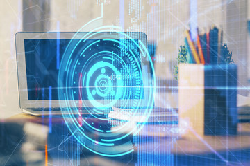 Double exposure of laptop computer and technology theme hologram. Concept of freelance work.