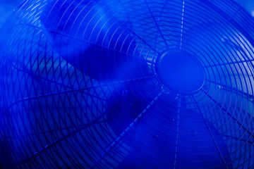 Fan, turbine in a dark smoky room with blue lighting