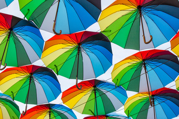 Colorful umbrellas background. Colorful umbrellas in the sky. Street decoration	
