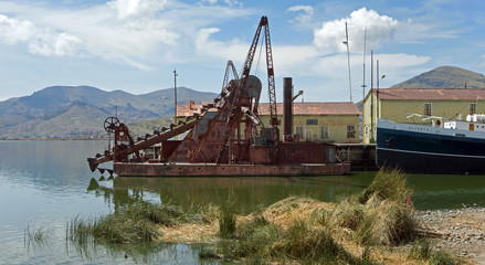 Rusty dredger at Puno Peru. Lake Titicaca.  Abandoned