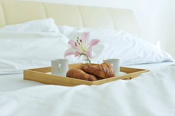 sweet breakfast with croissant to bed