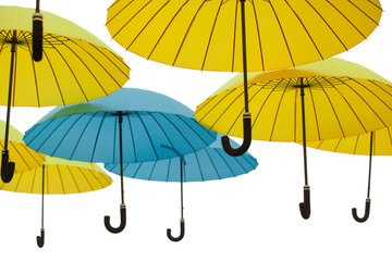 Colorful umbrellas background. Colorful umbrellas in the sky. Street decoration. Isolated on white	