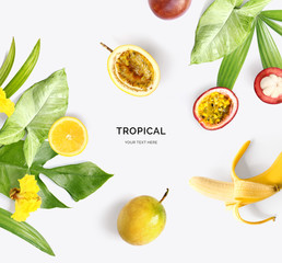 Creative layout made of mangosteen, banana, passion fruit, lemon and tropical leaves and flowers on...