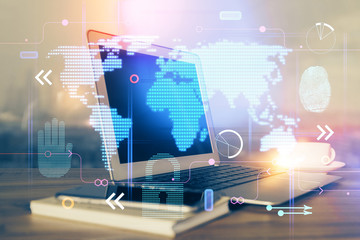 Multi exposure of table with computer and world map hologram. International data network concept.