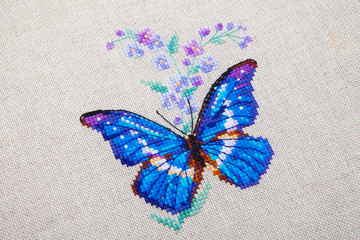 butterfly and flower pattern embroidered on fabric