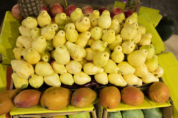 Yellow pears on the counter. Ripe tropical yellow fruit close-up.