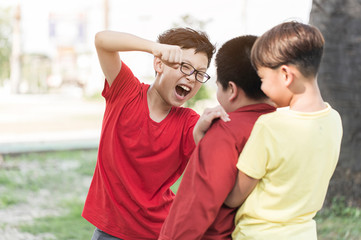 frightened Asian schoolboy being bullied playground in school. gang Children bullying their classmate on outdoor. Violence, Banner and problem of bullying concept