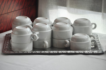 empty tea coffee cups on tray