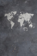 The contours of the map of the world from flour on stone surface