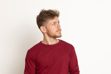 Fototapeta premium Attractive young guy with a red T-shirt