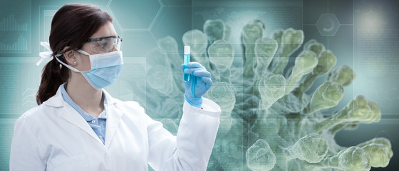 female chemist holding a test-tube, virus in background