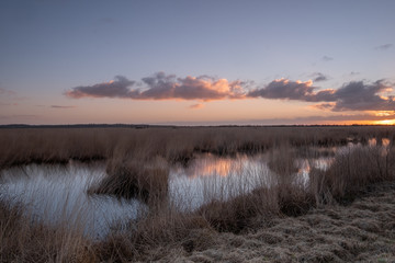 Landscape view sunset, water reflection, large nature reserve with peat soil, Fochteloerveen, The Netherlands
