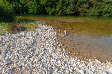 Obraz na płótnie Canvas Pebble beach on the Cetina River, Croatia