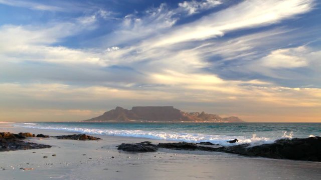cape town table mountain scenic view from bloubergstrand with splashing waves