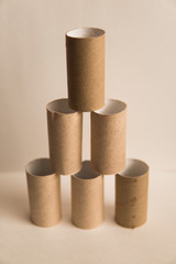 Empty toilet rolls stack on a white background