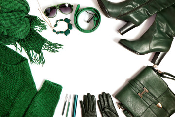 Fashion accessories, clothing and decorative cosmetics are green on a white background.