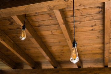 Vintage light bulbs on wooden background